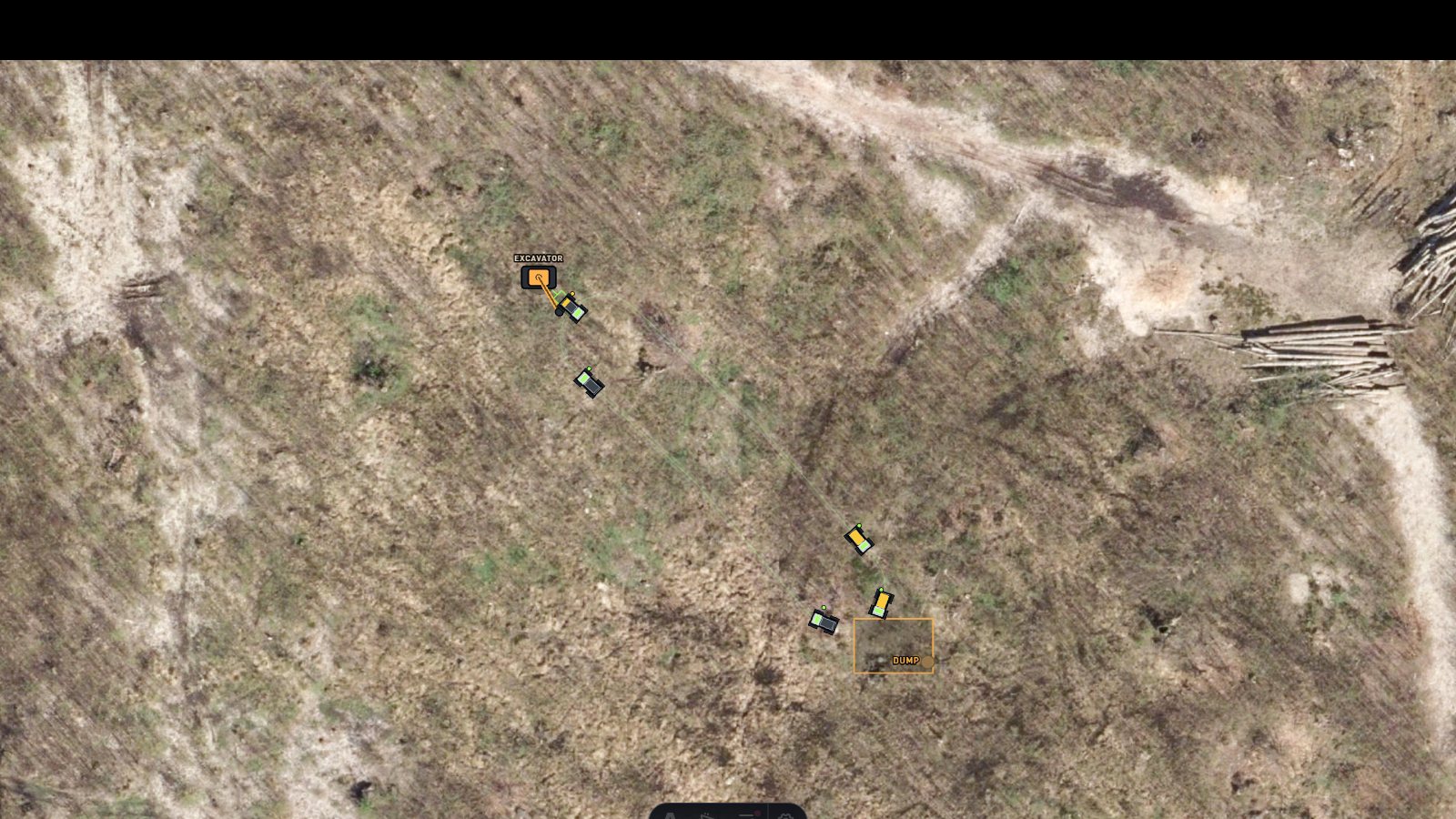 Top-down fleet control — rovers hauling between an excavator and a dump zone on a live satellite map